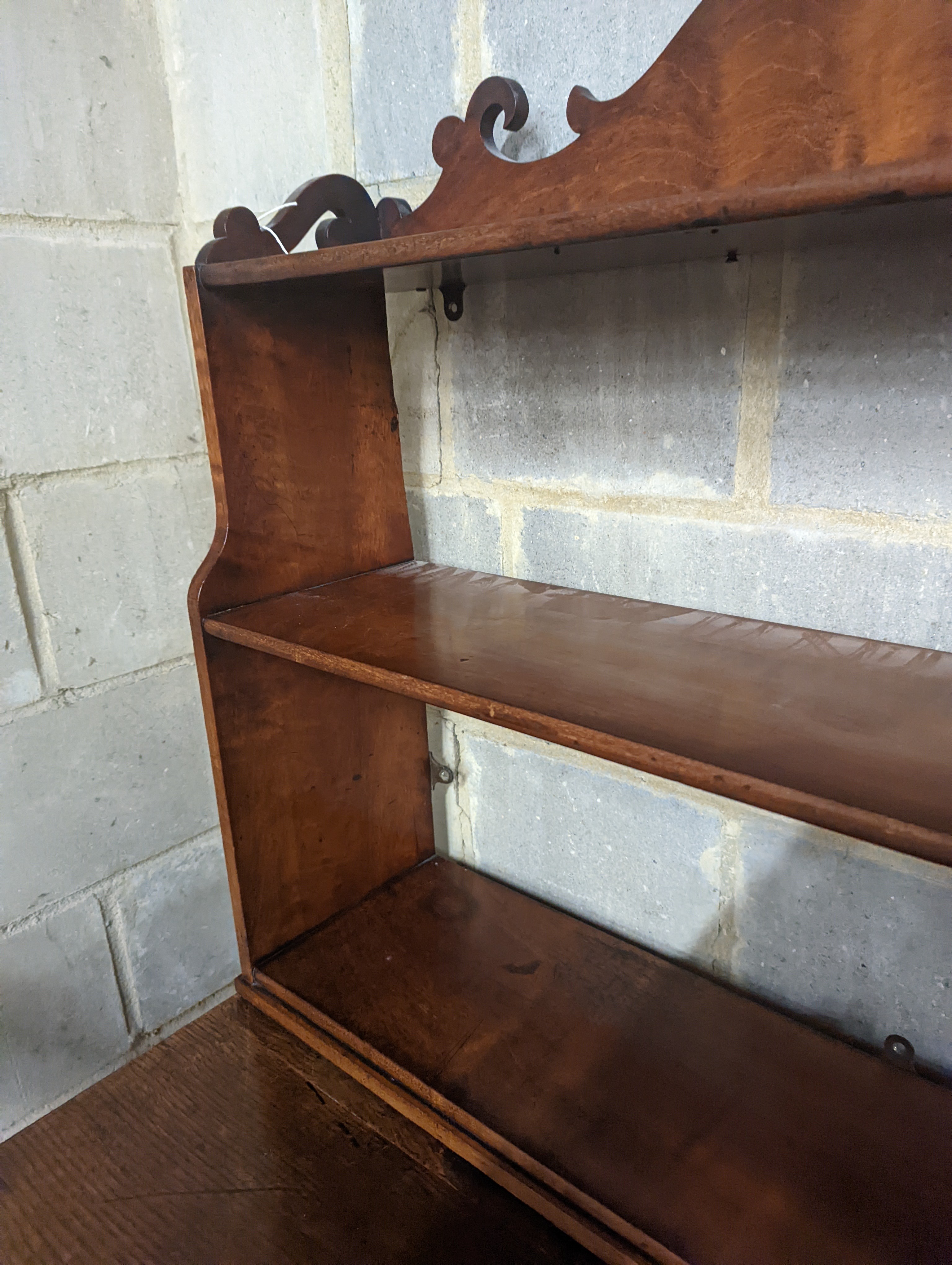 A Victorian mahogany wall bracket. W-90cm, D-22cm, H-70cm.